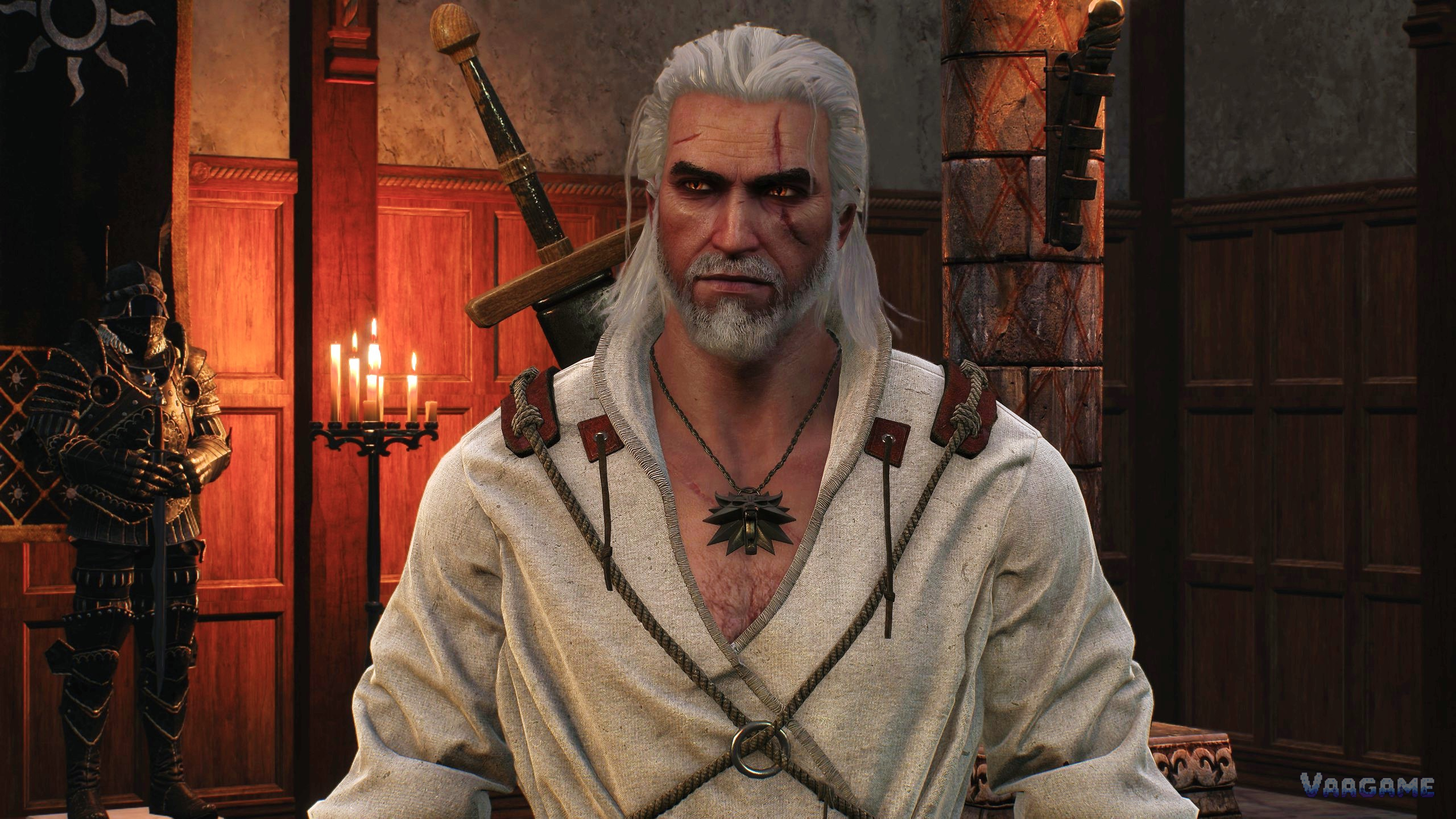 A portrait of Geralt in a white shirt with his wolf medallion