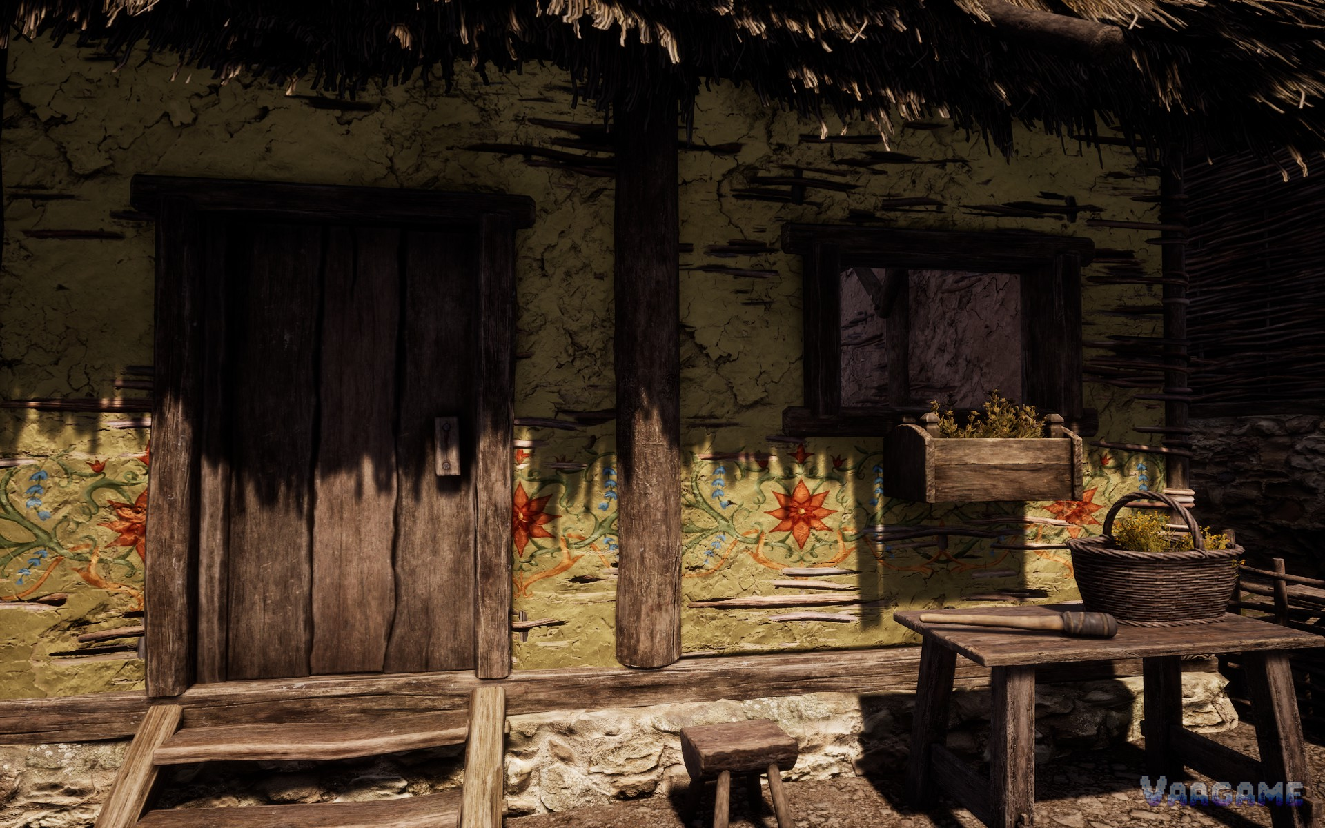 Painted wattle house front with a herb basket and hammer