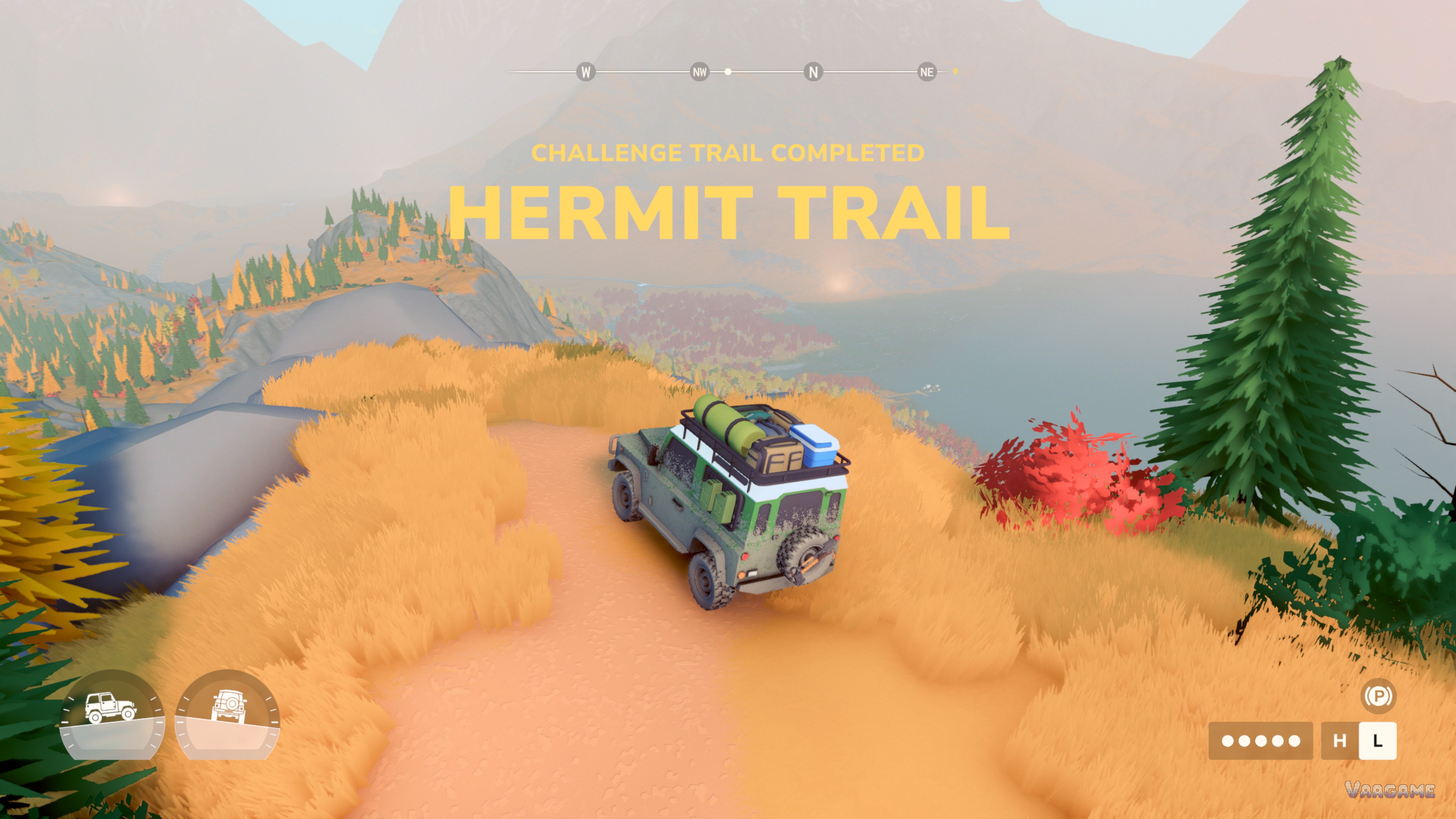A challenge trail completion banner for Hermit Trail above a wagon on a ridge