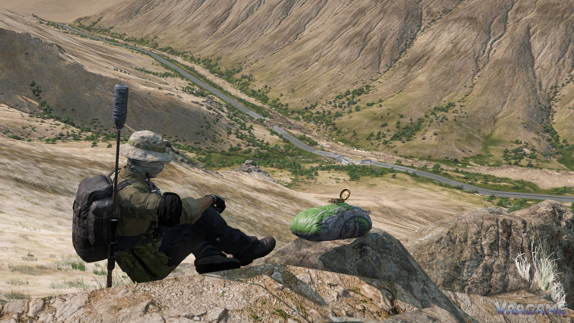 A survivor resting on a rocky hill over a desert valley