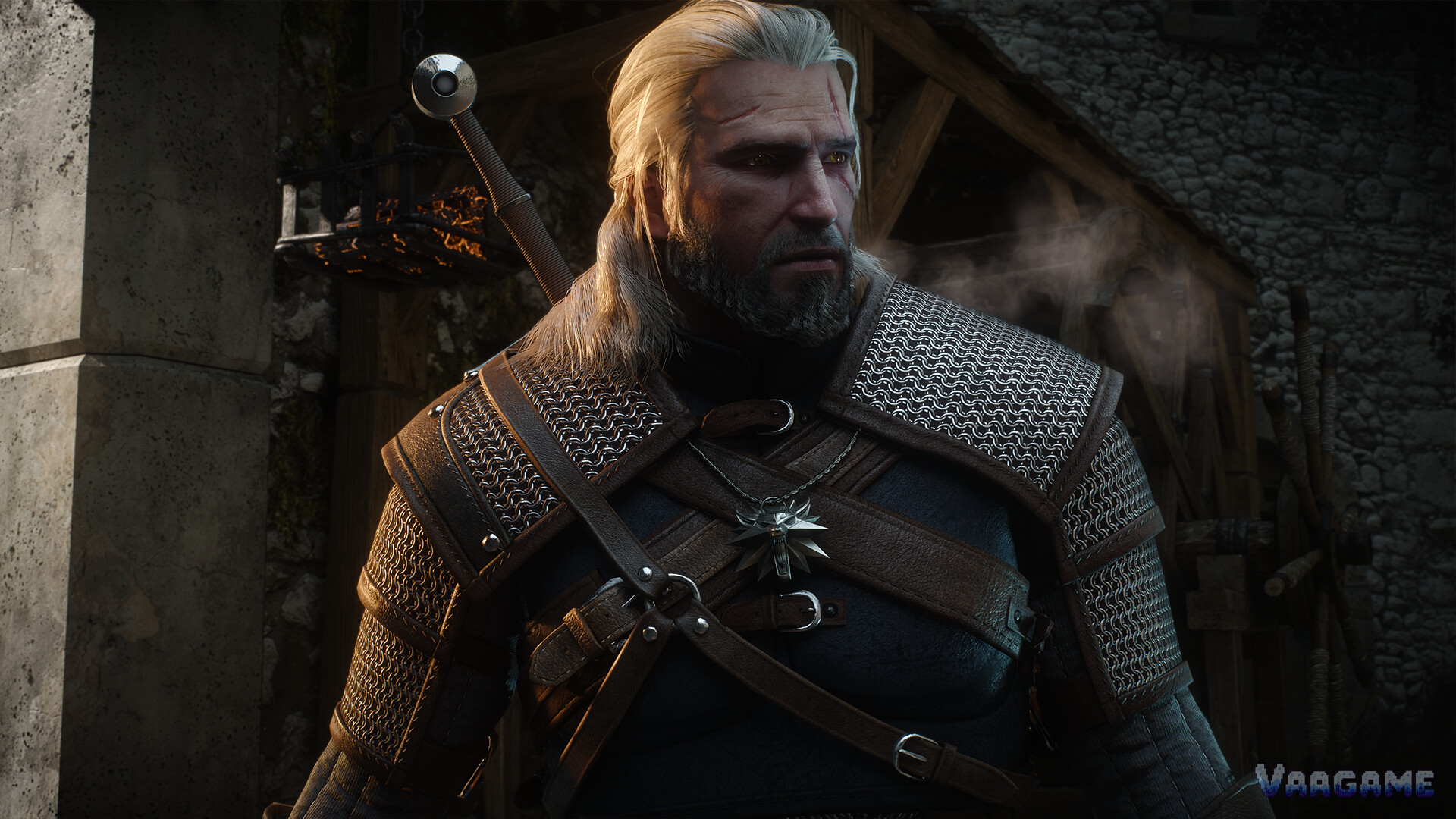 Close-up of Geralt in chainmail witcher armour, wolf medallion at his chest