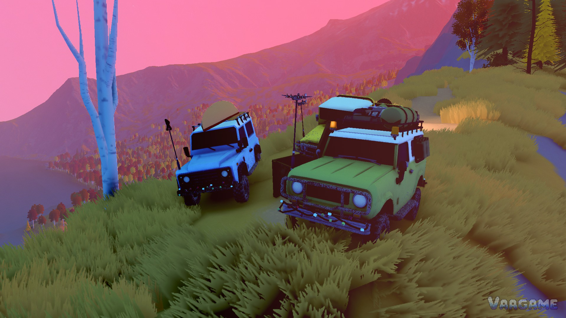 Two dressed expedition wagons parked on a grassy ridge under a pink dusk sky