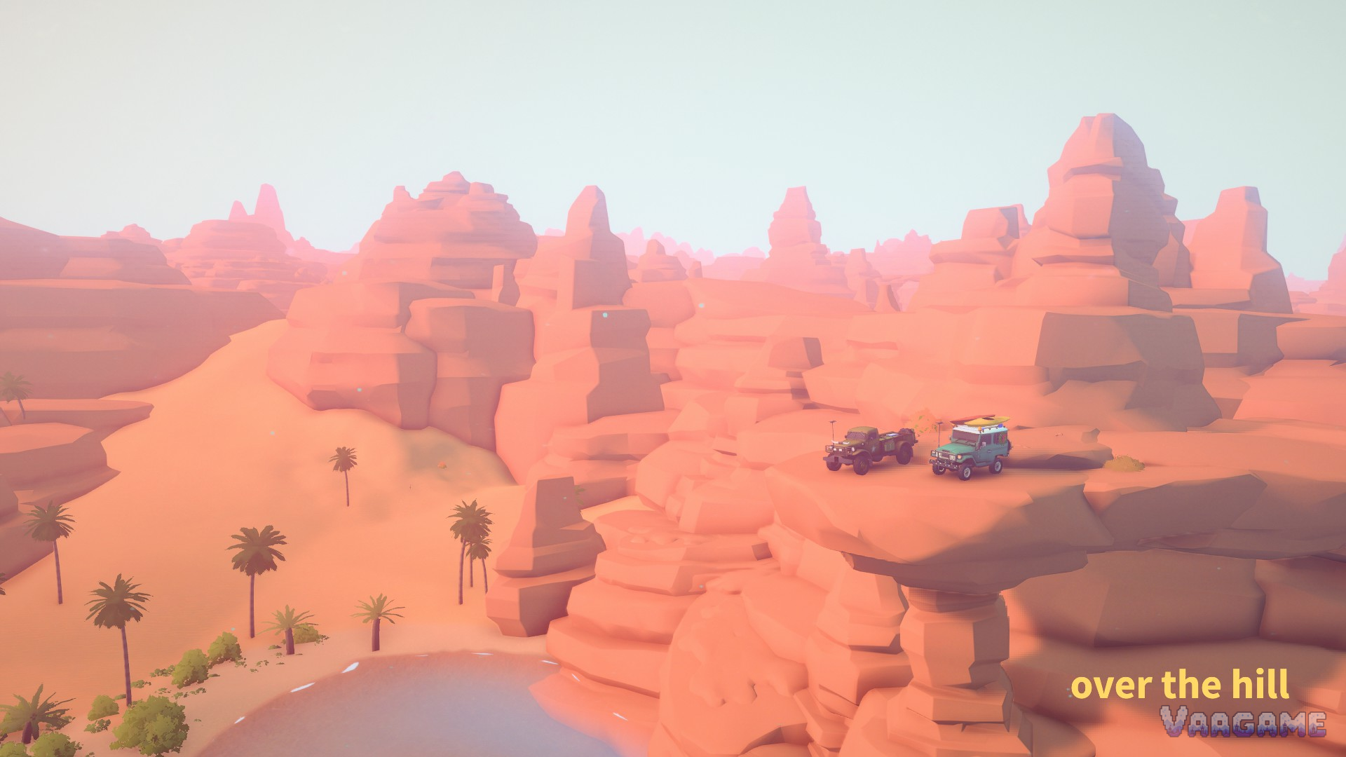 Pink desert rock formations in Algeria under a bright sky