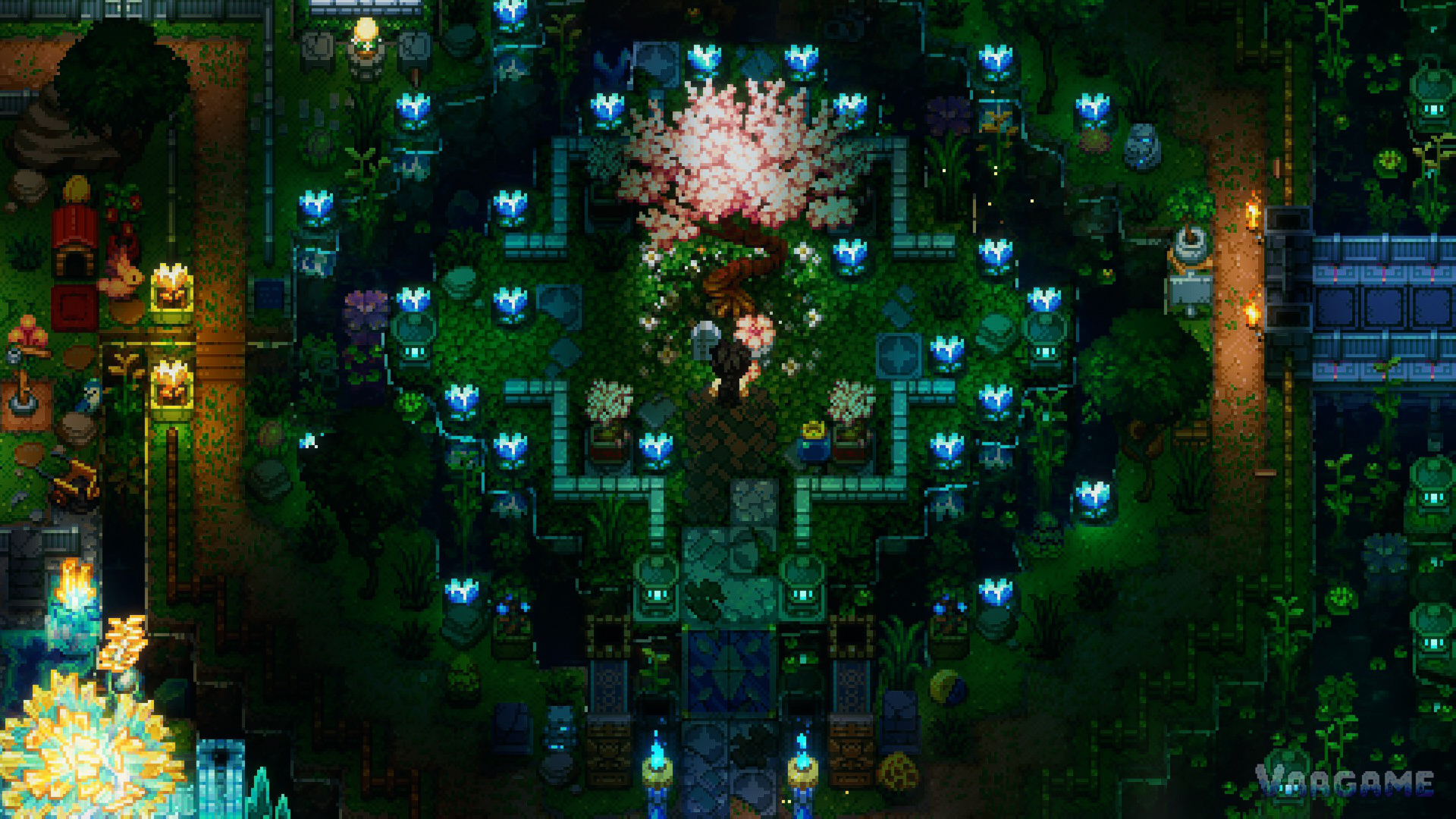 A garden base at night, crops and paths picked out by lamplight
