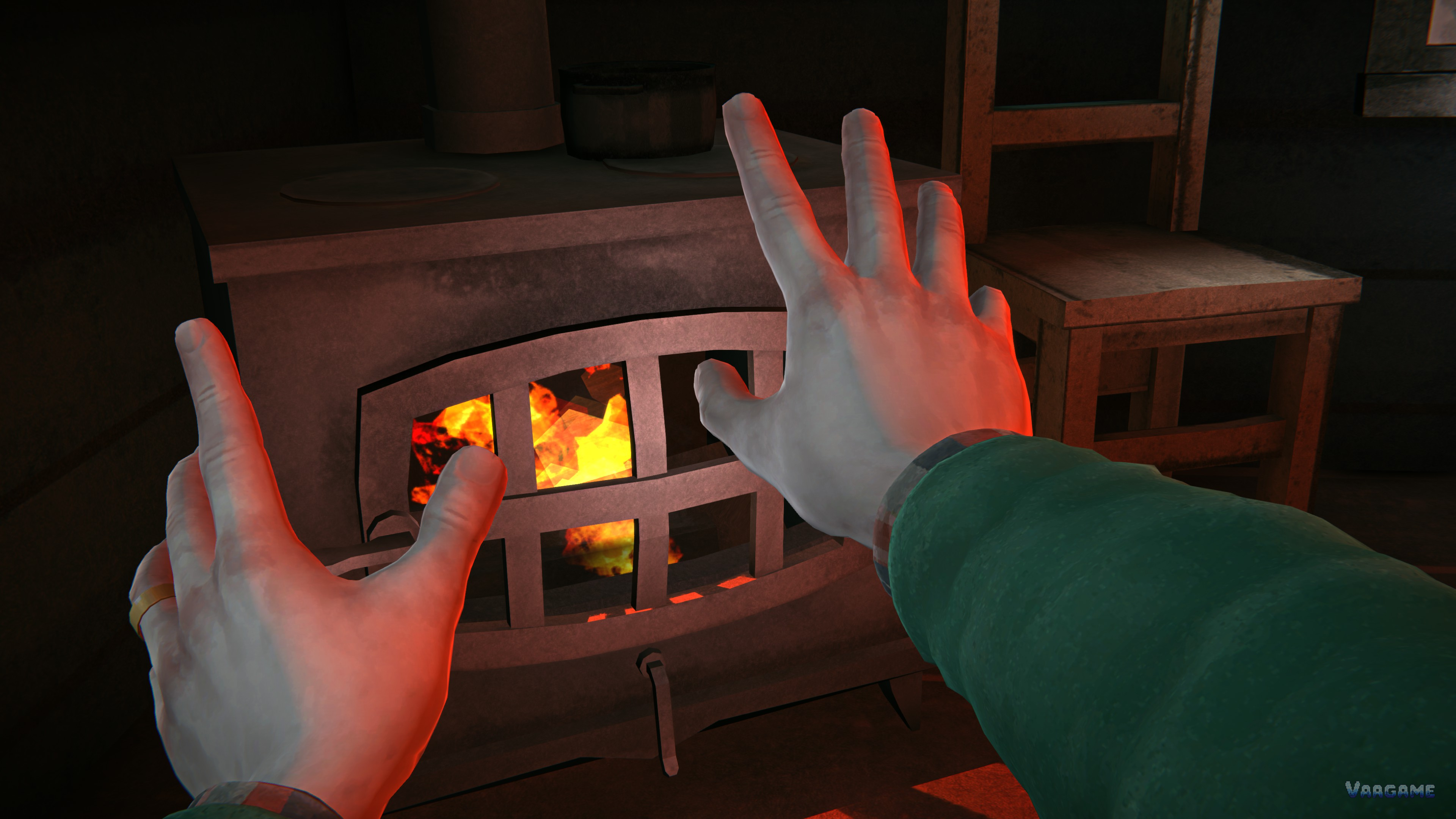 Hands warming by a wood stove fire