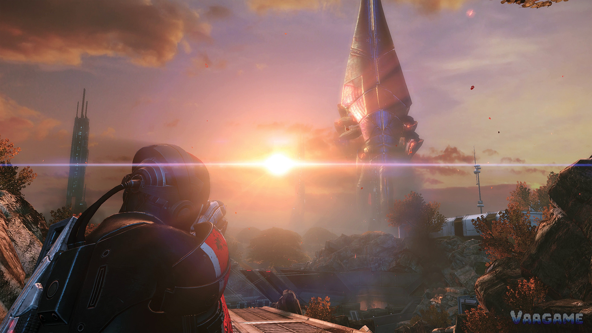 Commander Shepard in N7 armor watching a massive ship descend on an alien world at sunset