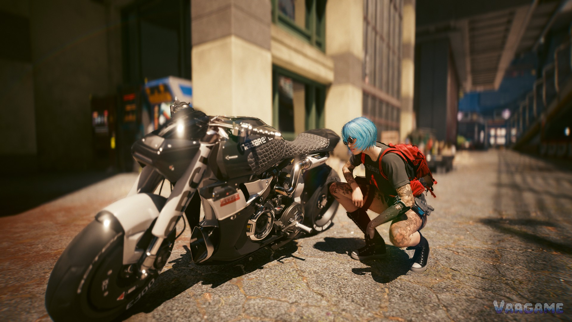 V crouching beside a motorcycle on a city street in Cyberpunk 2077