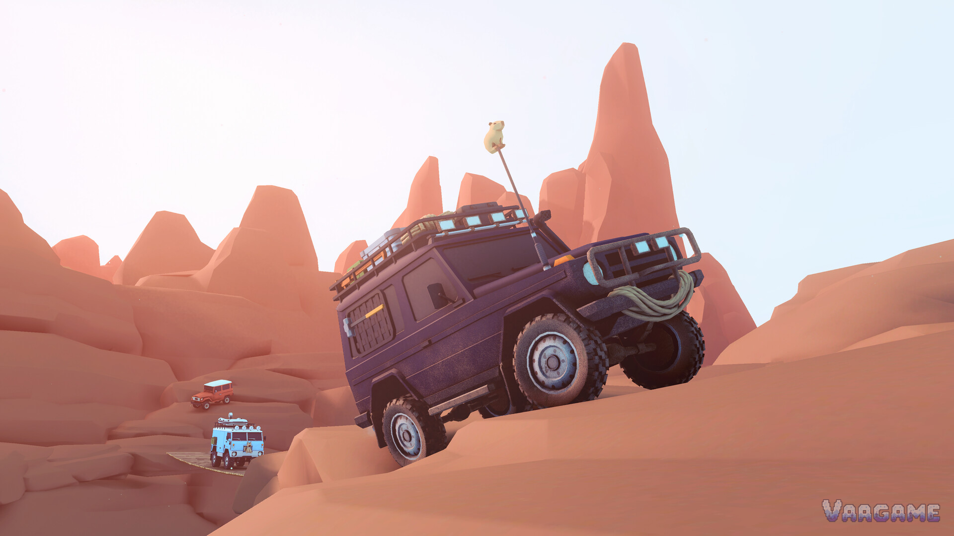 A dark wagon tilted hard on a steep sand dune, with two more vehicles waiting below