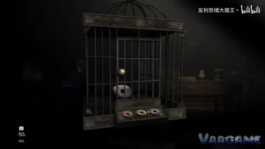 The bird cage in the Quiet Hours Cafe, its three coloured sockets empty