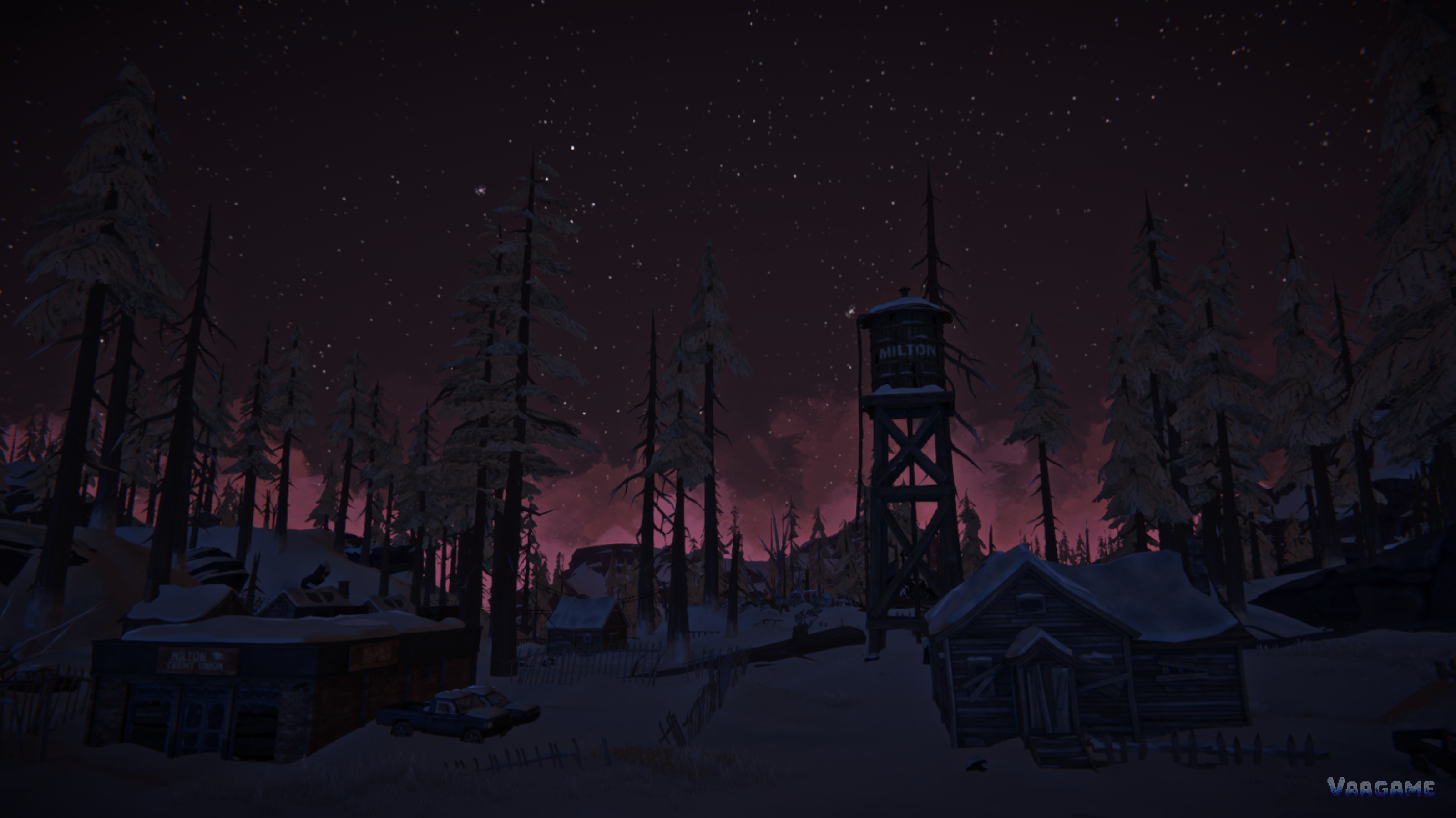 Snowy town at night with a watchtower