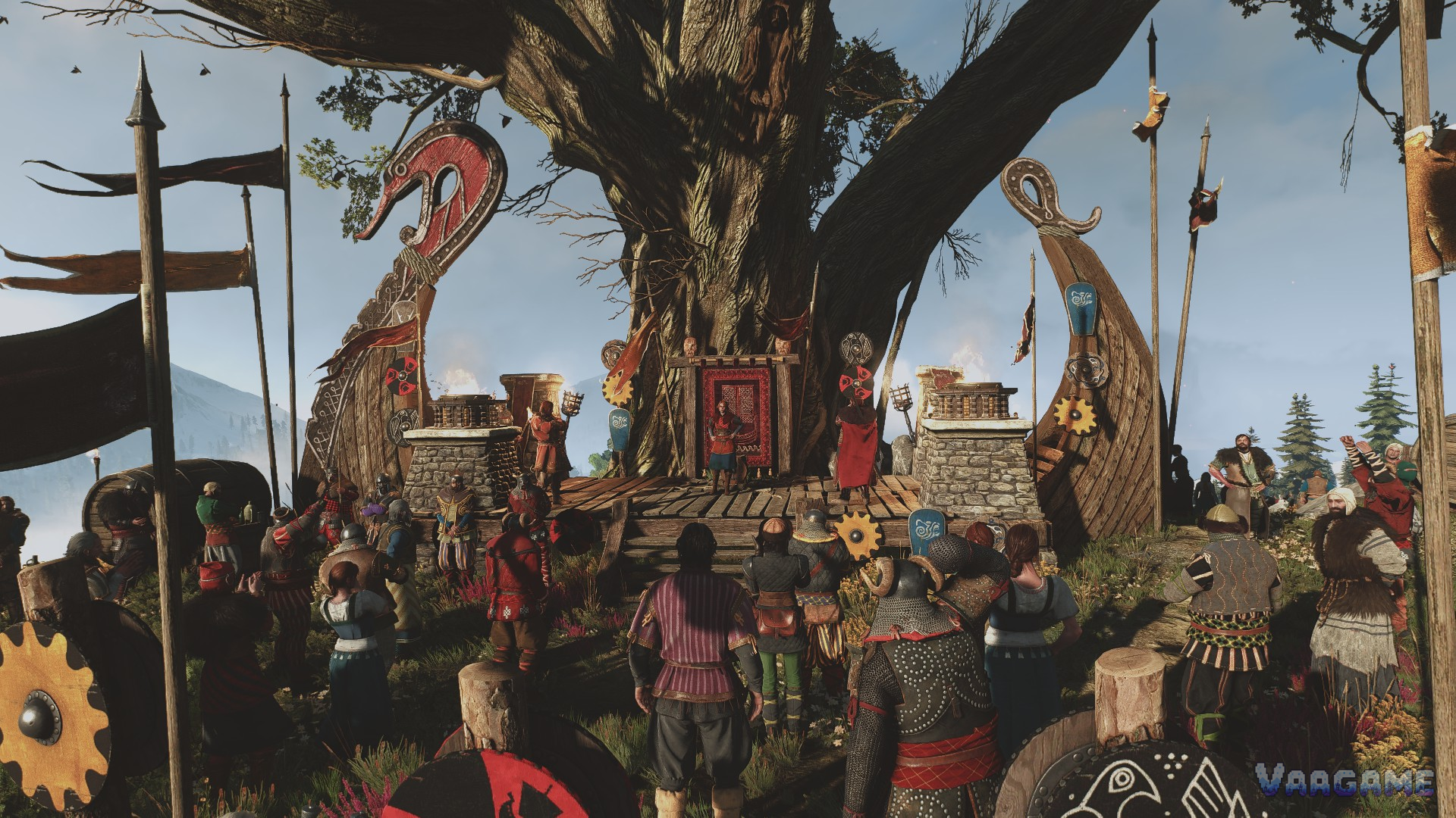 A crowd gathered for a feast beneath a great tree