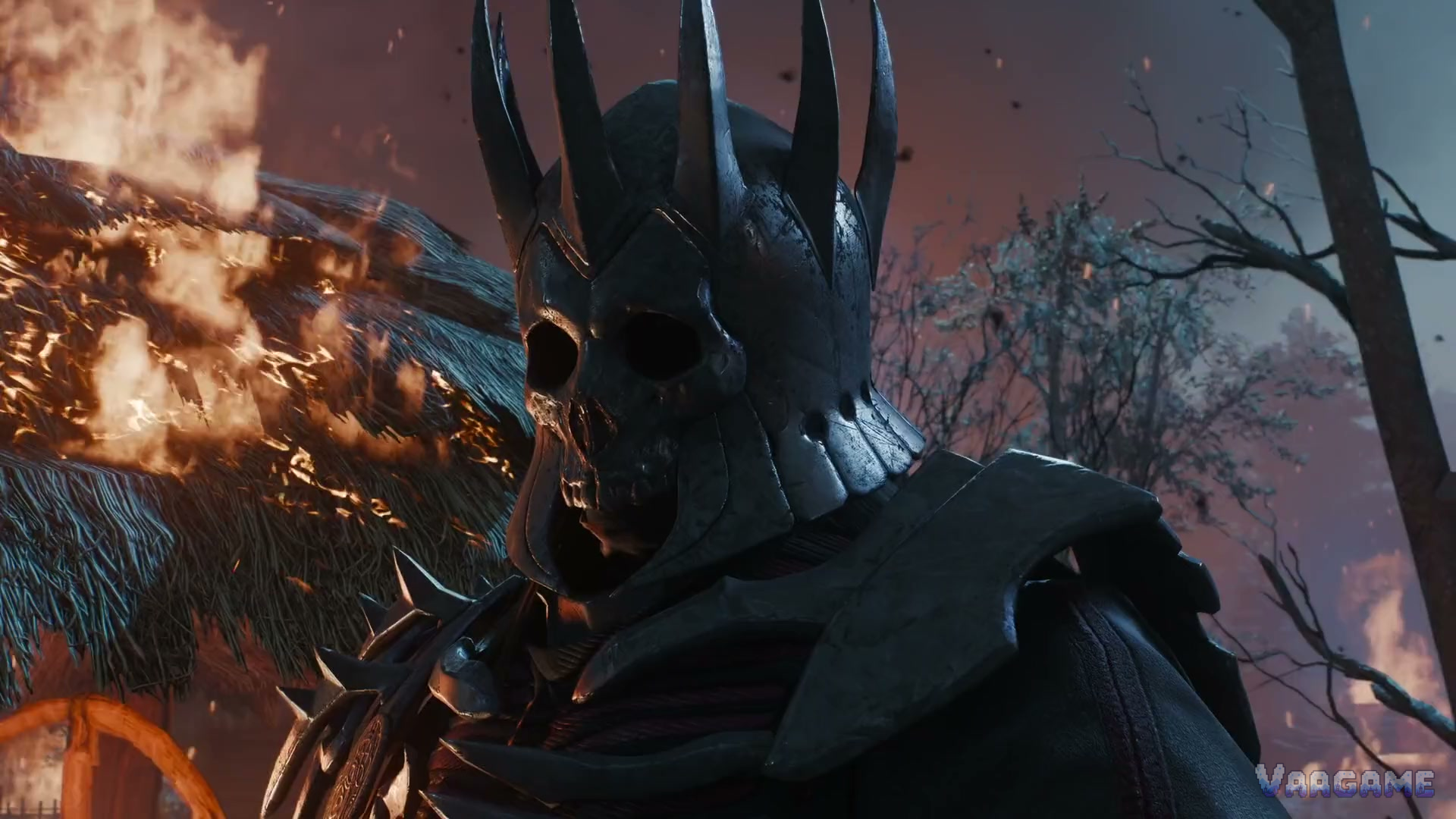 Eredin, king of the Wild Hunt, in his skeletal crown-helm before a burning village