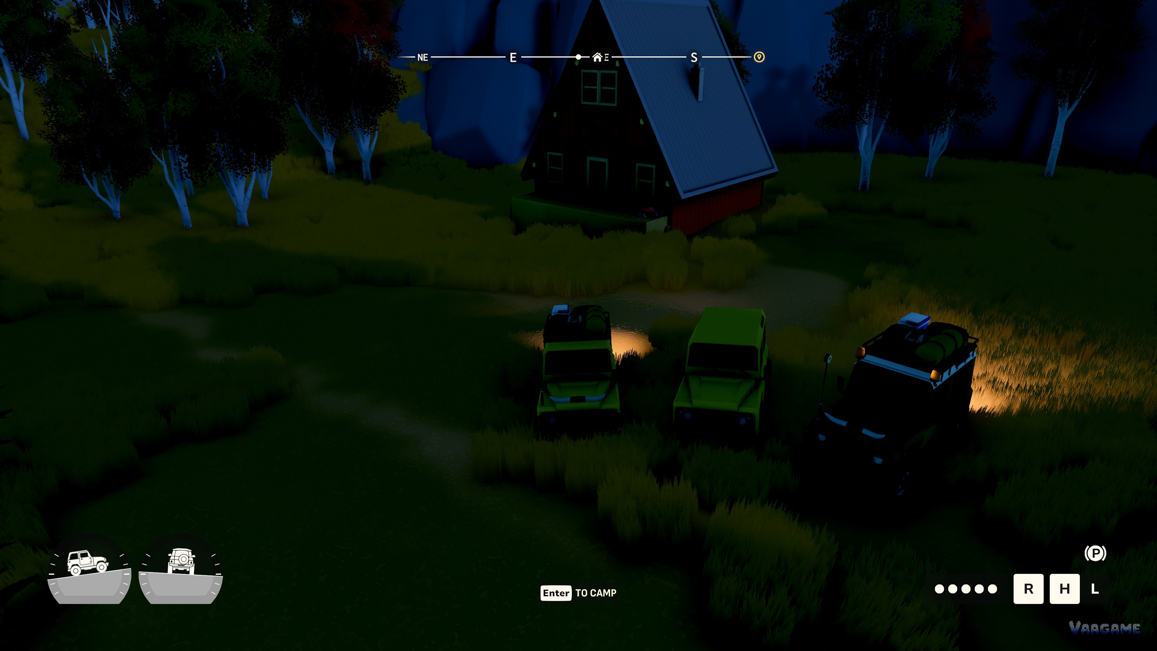 Three 4x4s with their lights on, parked at a forest cabin camp at night