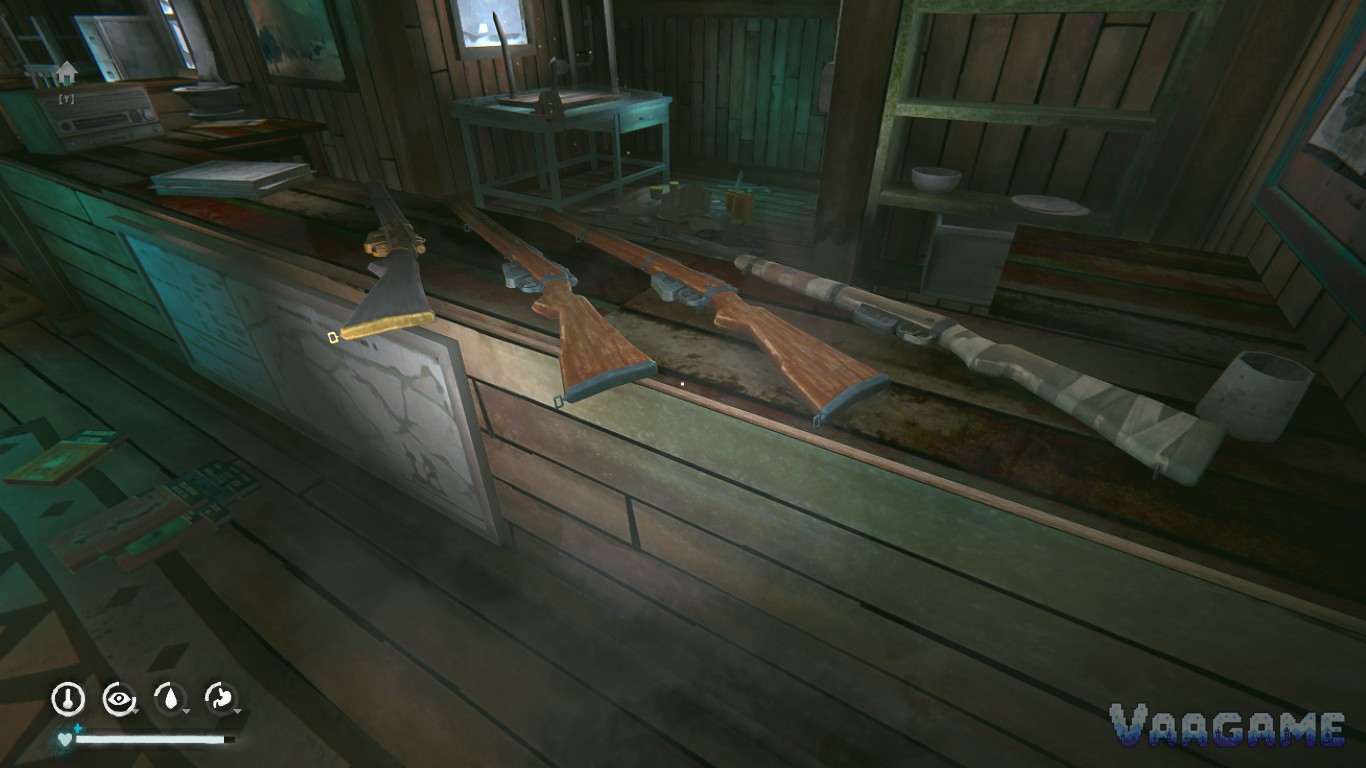 Rifles laid out on a wooden counter indoors