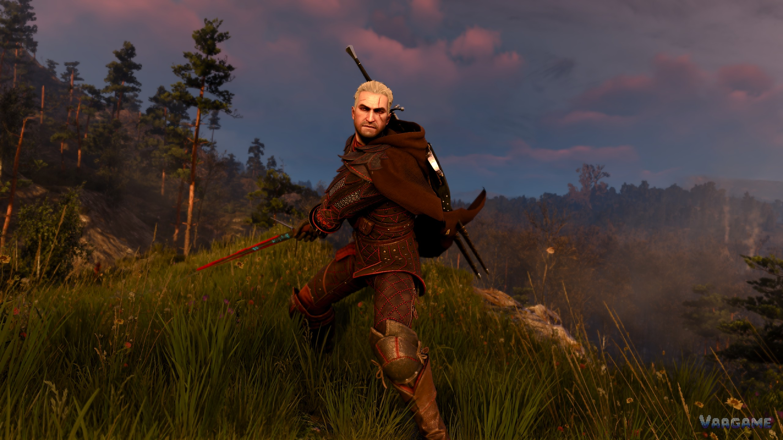 Geralt drawing his sword in a field at dusk