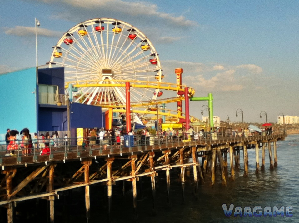 Ferris wheel and pier deck on Santa Monica Pier in daylight