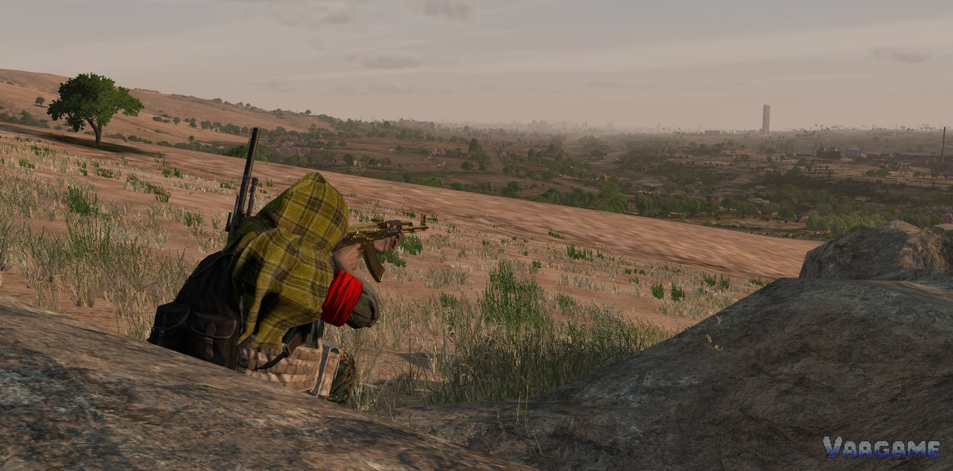 A survivor aiming a golden rifle over desert hills