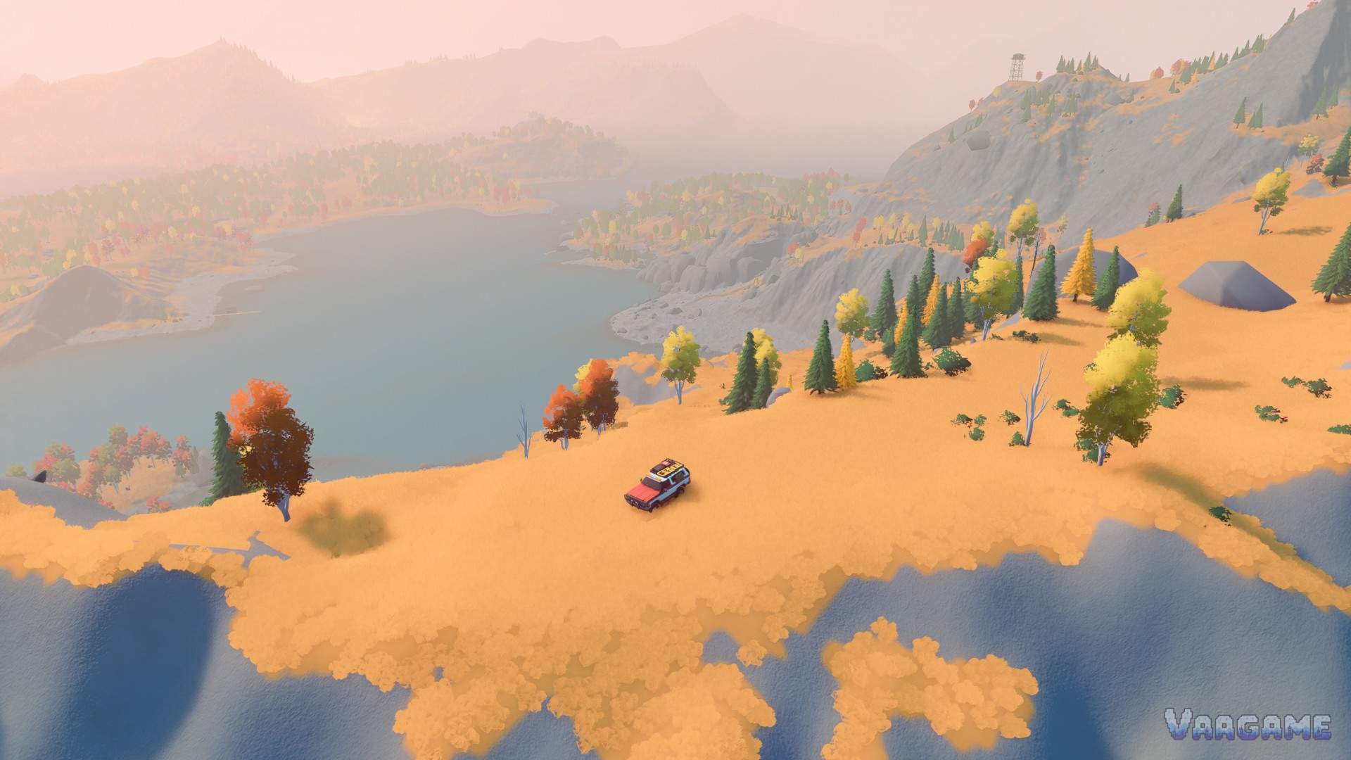 An aerial view over Emerald Lake country with a lone wagon on the shore hills