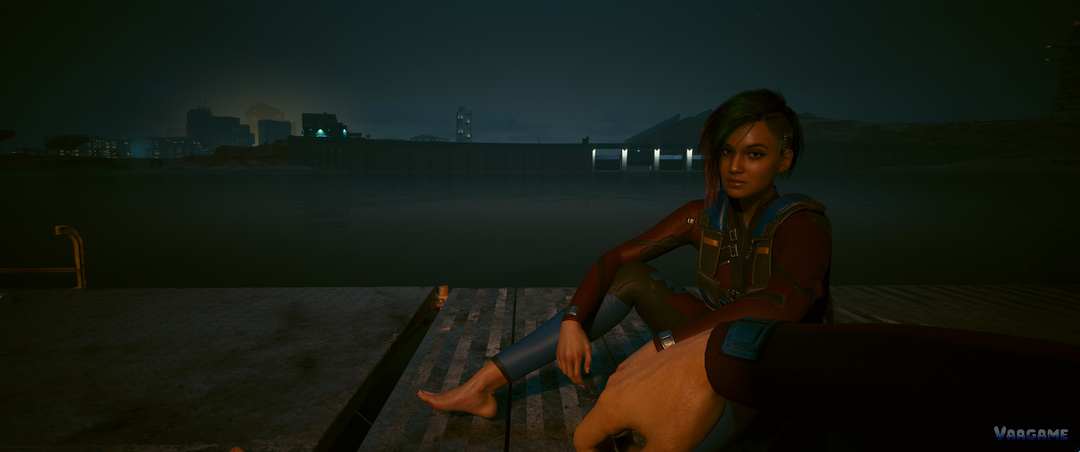 V sitting by the water at night in Cyberpunk 2077
