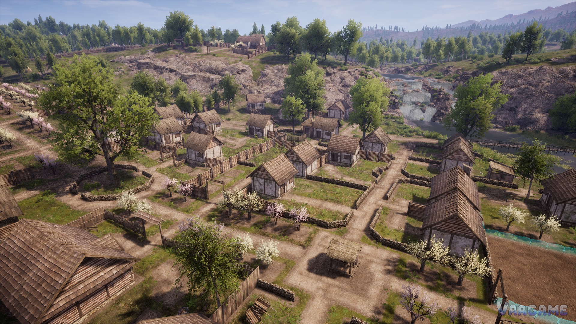Aerial village with orchards fields and a river