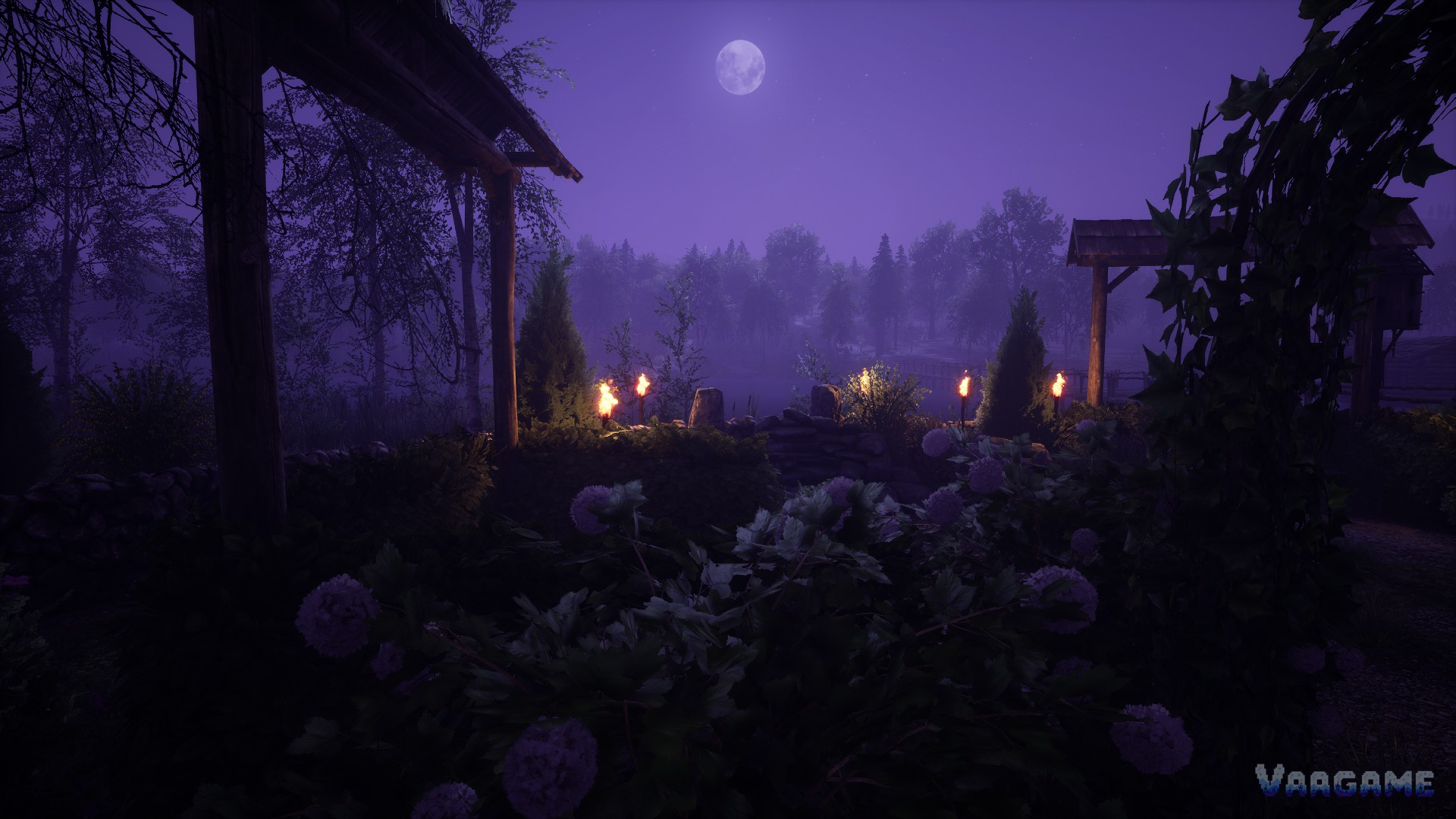 Moonlit night garden with burning torches