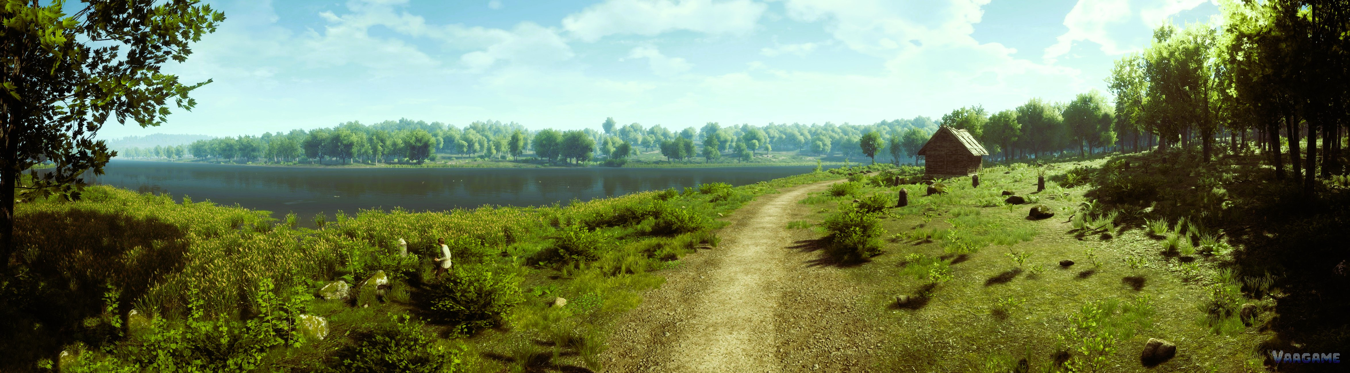 Wide lakeside panorama with a dirt road and a lone hut