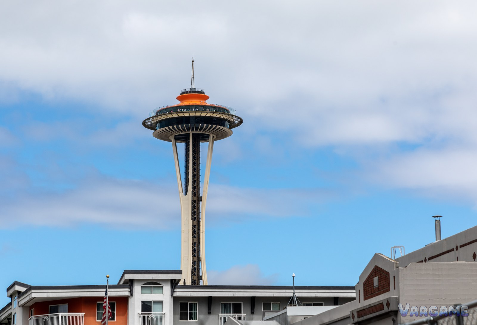 Space Needle tower with orange top against blue sky in Seattle