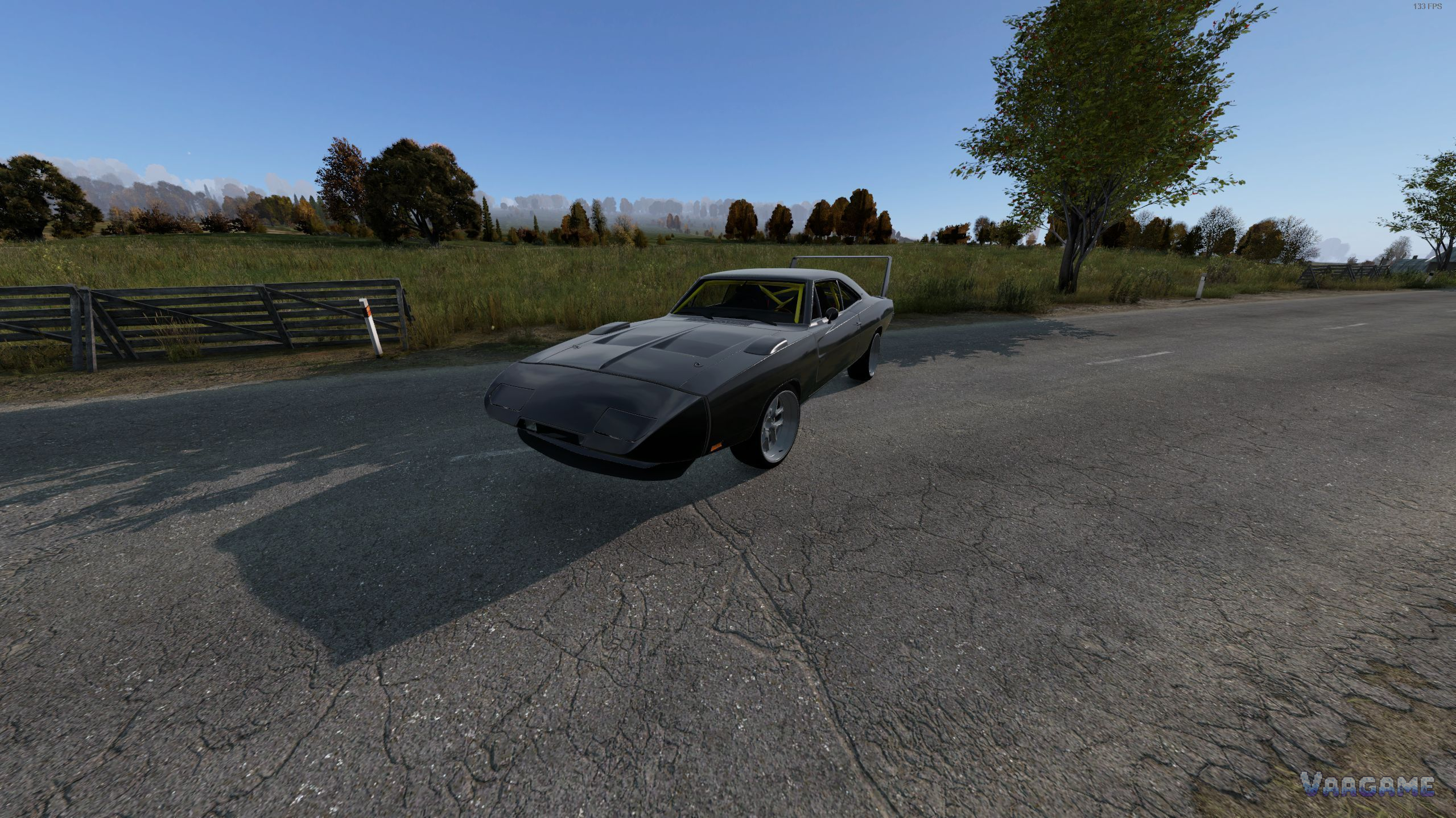 A black muscle car from CarPack on a road