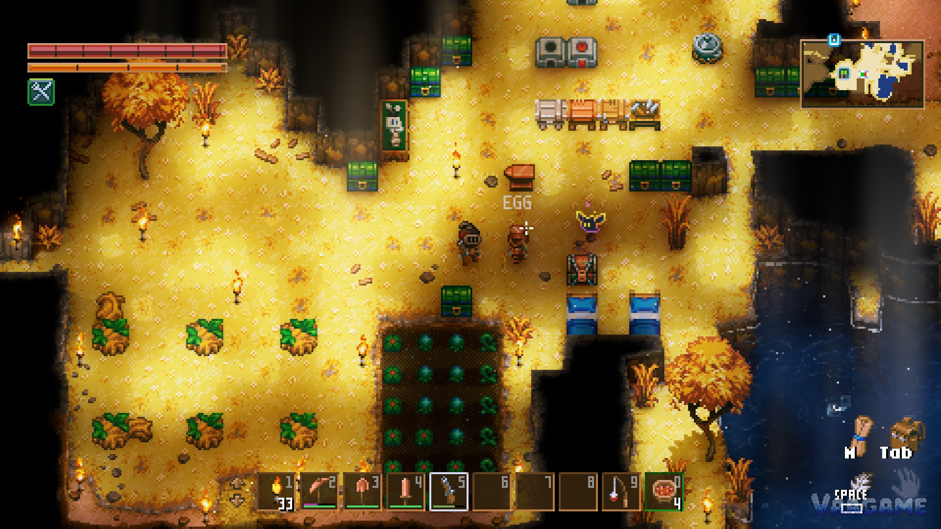 An early desert camp with workbench, furnace, chests and a row of carrots