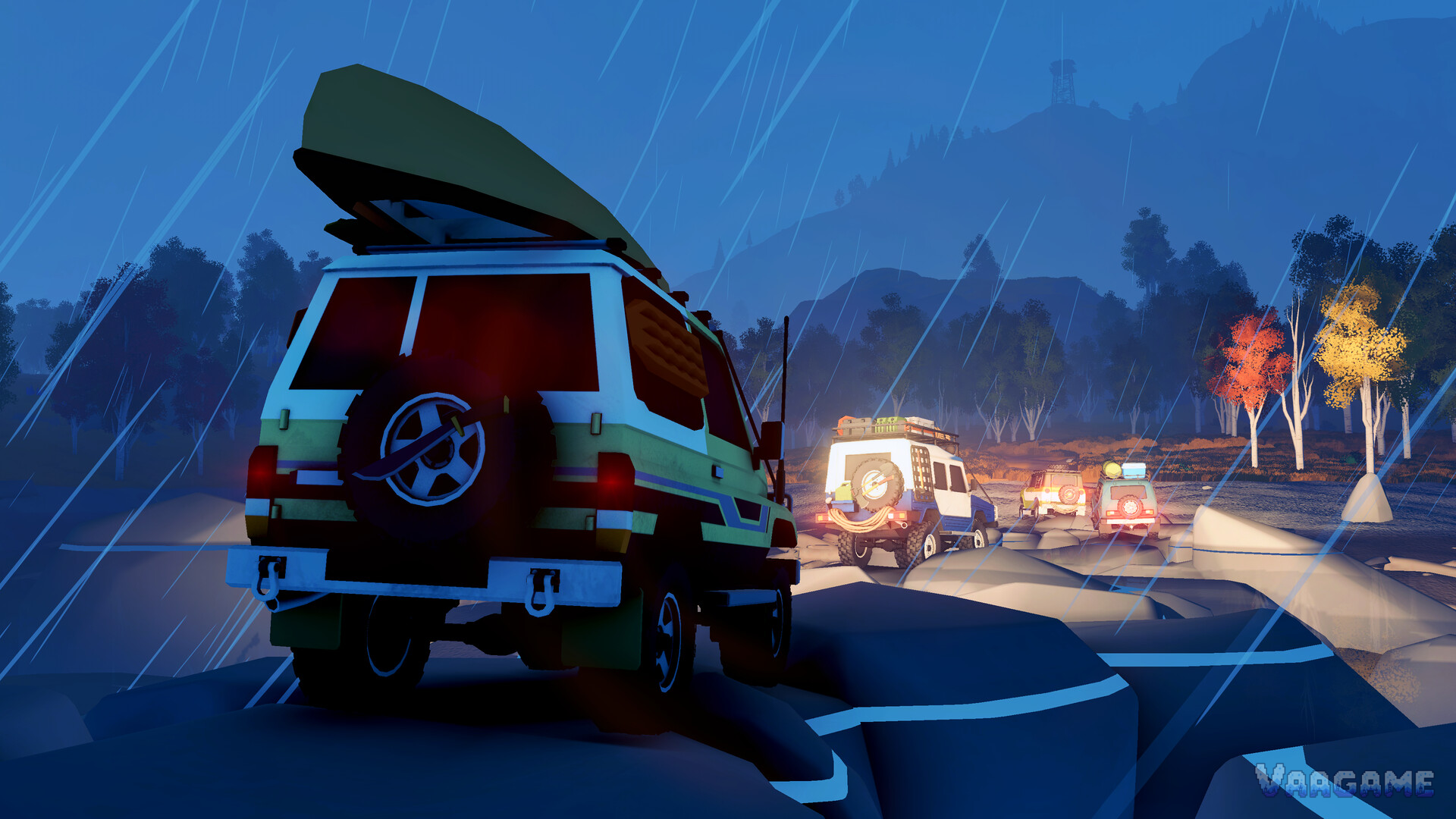 A convoy driving through rain at night, headlights reflecting off wet rock